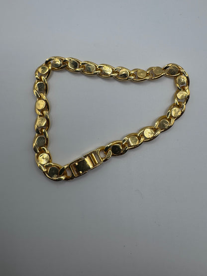 gold-tone curb link bracelet featuring sparkling clear rhinestones